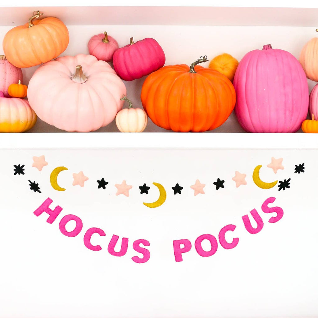 Create a spellbinding look in any room with this Hocus Pocus Felt Garland! Crafted with colorful felt, this garland is a perfect way to show your love for the spellbinding movie. Sure to give your space some magical style - presto chango!     Size  5’ Long   Hot Pink Felt letters are appx. 3.5" tall 