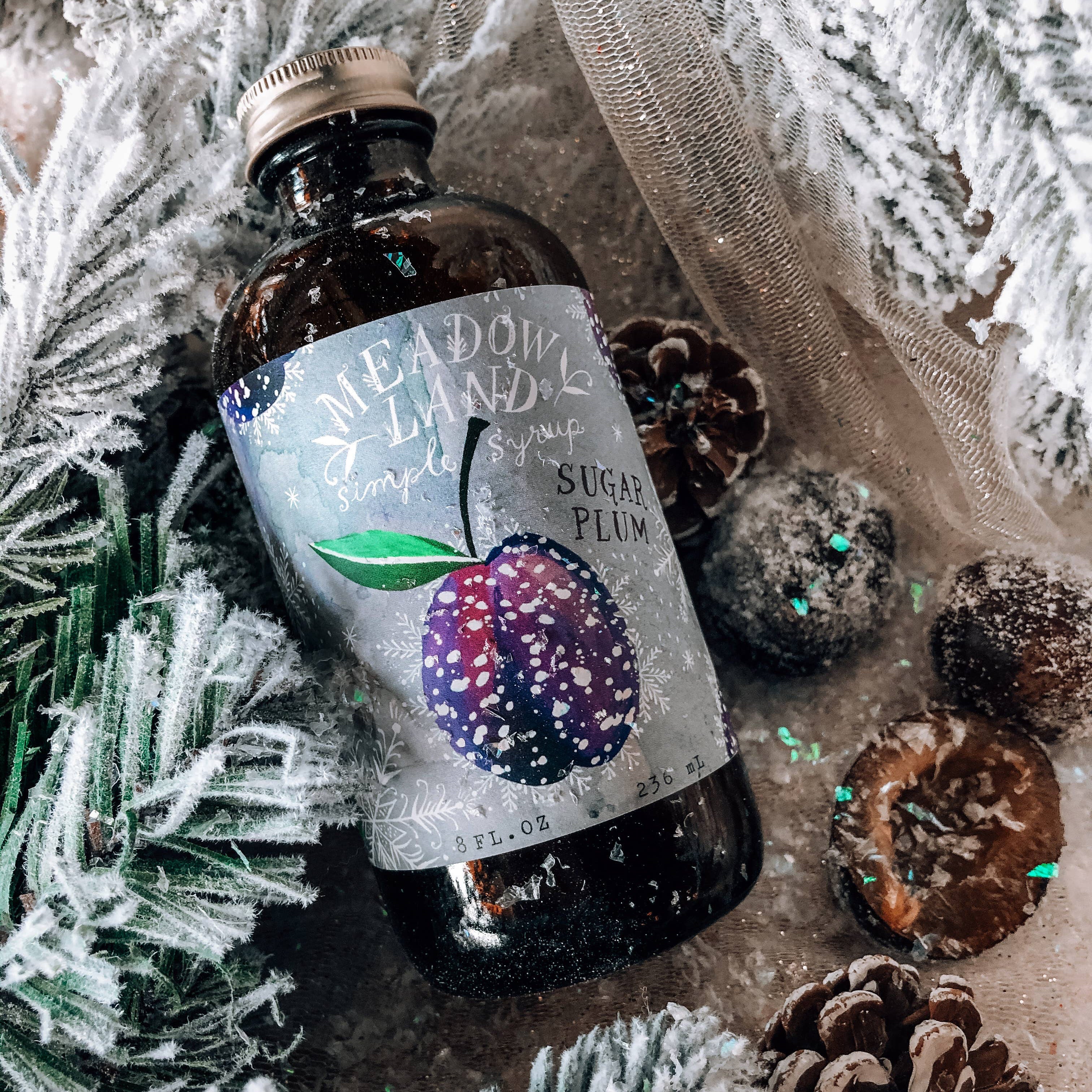 This Oregon-made, handcrafted simple syrup is a festive addition to any wintry cocktail. Also makes a delicious glaze for pastries!

Details:

Tasting Notes: a frosty sugared plum, glittering snow, enchantment.
Ingredients: pure cane sugar, plum juice, cream of tartar. 236 ml (8 FL. OZ) of magical goodness!
We use locally harvested and organic ingredients whenever possible.
Non-GMO, no artificial colors.
Once opened, keep refrigerated for optimum freshness
Retail size: 236 ml (8 FL. OZ) of magical goodness!