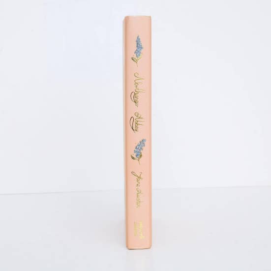 Cosmetic product with floral design on a light background