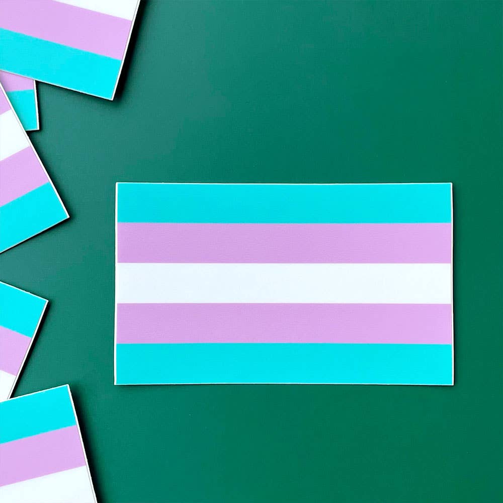 Trans pride flag sticker ready for sticking on laptops, water bottles, your car, or anywhere else you can think of.

The Transgender Pride Flag, created by American Trans woman Monica Helms in 1999, just in sticker form! 3.3" x 2"