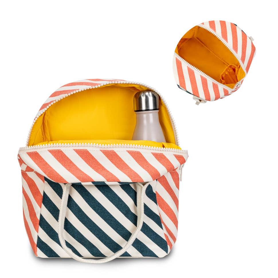 Certified organic cotton. Preshrunk and fully machine washable. Cotton canvas carry handles. Zipper closure. Rinse-able, tested food-safe lining. Interior pocket (for a water bottle or ice pack). Durable and roomy. Lunch bag is lined but not insulated. Water-resistant lining works well with an ice pack, if desired. Stripe Teal Apricot pattern.