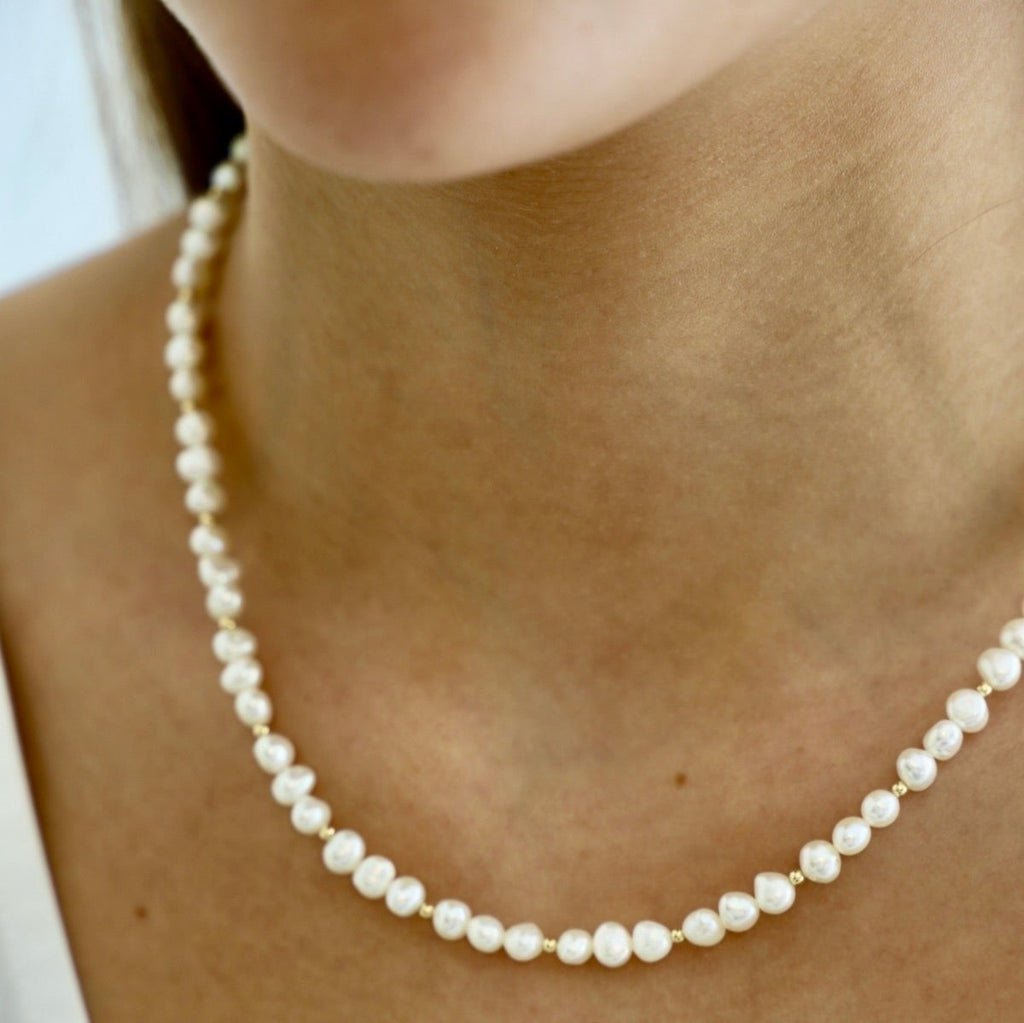 Our Kailani Necklace is a beautiful beachy necklace that is perfect to style everyday for this summer season. Made out of our freshwater nugget pearls and gold filled beaded accents, everyone will be asking you where you got your modern pearl necklace.
