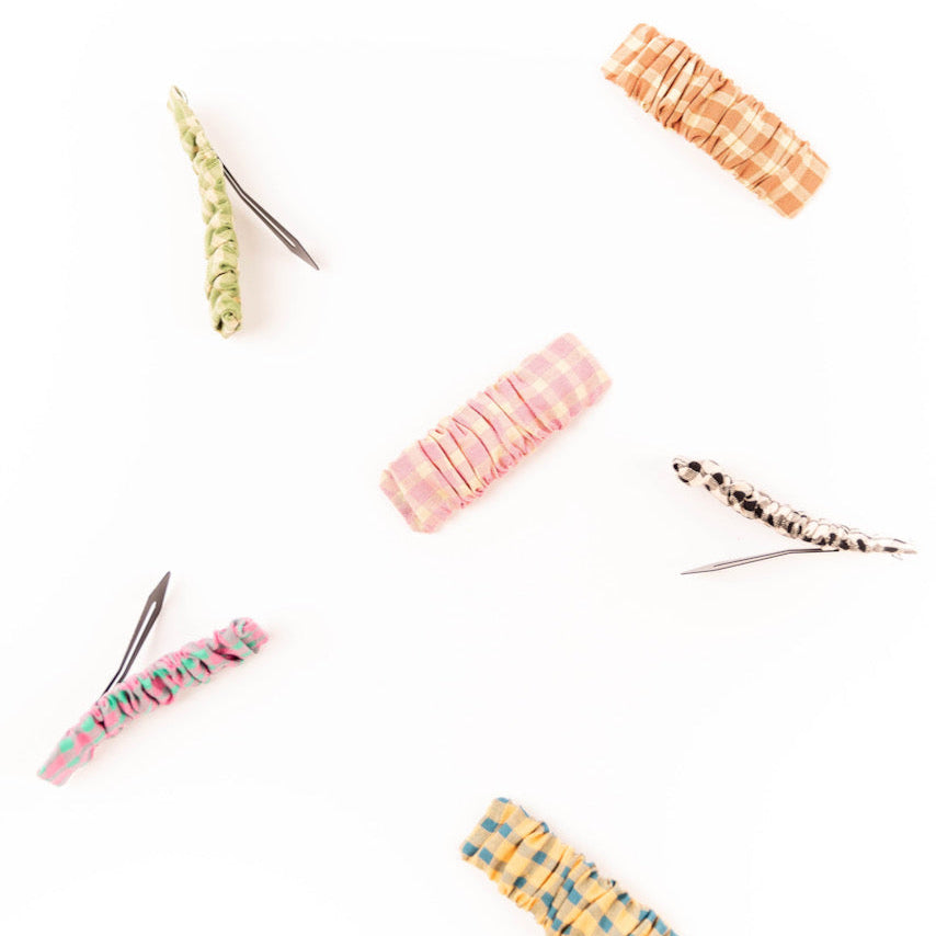 Want to add something extra to your hair? Well then these ROOLEE Frosty Palace Clip Set to your accessories! These cute hair clips have a scrunchy fabric and come in a variety of colors. Pair it with a cute dress or simple jeans and a tee!