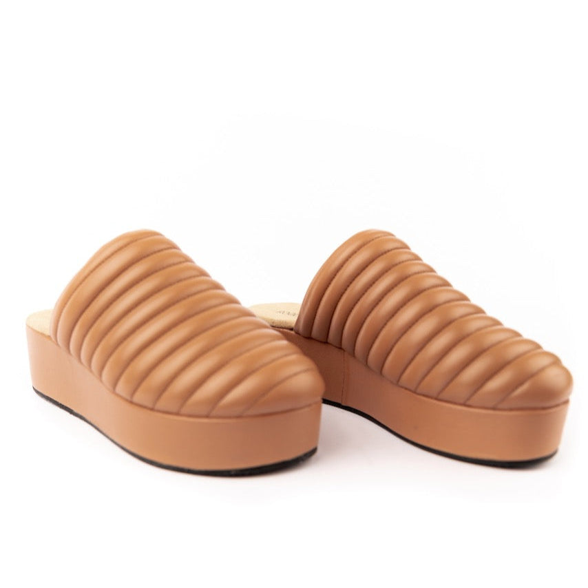Our first thought for this shoe was 'foot couch' and here's why: quilted toe, platform design, + comfy footbed. It screams 'couch' for all the right reasons. This mule is basic but elevated. But be warned—it’s the kind of shoe that has people chasing you down the street to ask where you got it. And she pairs effortlessly with all your favorite looks from denim to dresses