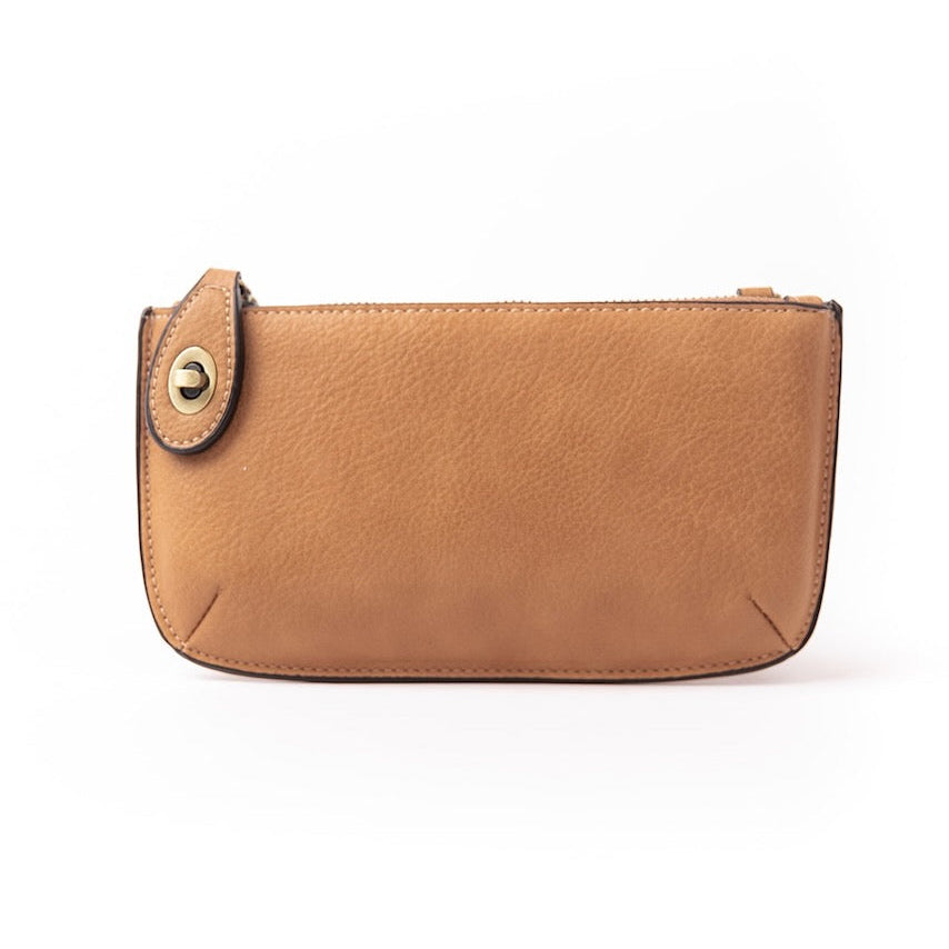 The Uptown Messenger Purse is perfection in a handbag! This versatile piece can be used as an adjustable cross-body bag, wristlet, or a simple wallet, making it the perfect finishing touch to any night out. A zippered top and rotating clasp closure are timeless elements that will make this the most functional purse you'll ever own!
