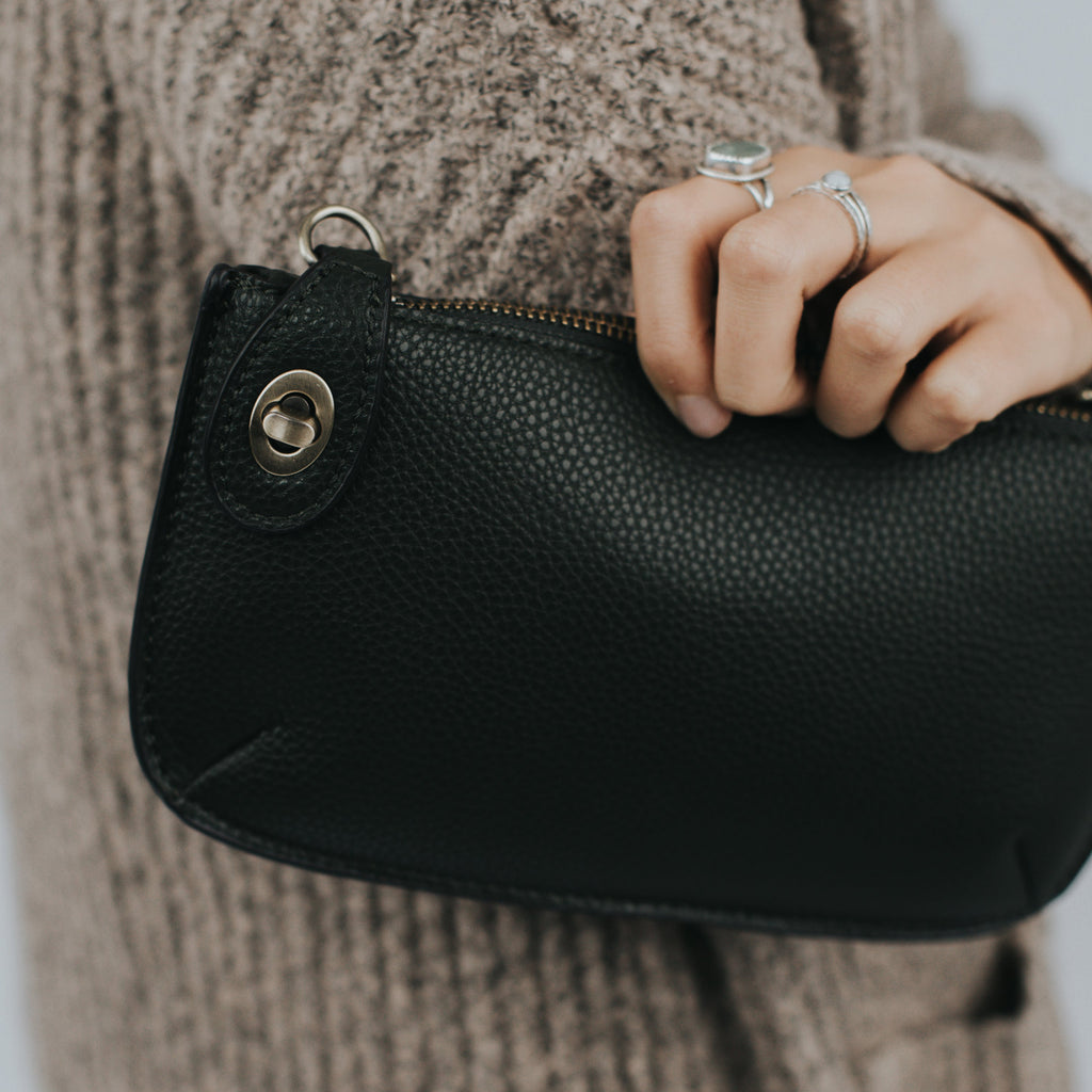 The Uptown Messenger Purse is perfection in a handbag! This versatile piece can be used as an adjustable cross-body bag, wristlet, or a simple wallet, making it the perfect finishing touch to any night out. A zippered top and rotating clasp closure are timeless elements that will make this the most functional purse you'll ever own!