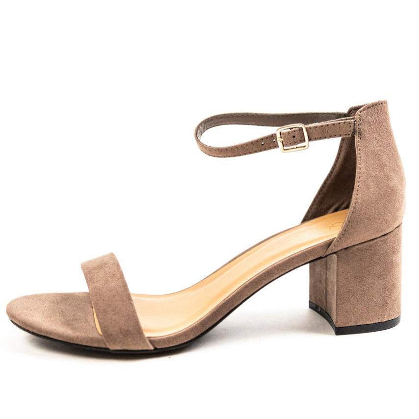 The perfect summer heels for the everyday boss babe! These faux suede heels are designed with a block heel, an ankle strap, and a strap that goes over your toes & Wear with your linen trousers, flowy skirts, or favorite dresses, these heels can bring every outfit to new heights! Tan