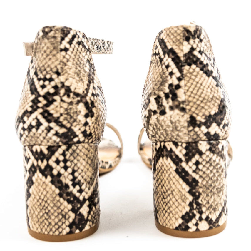 The perfect summer heels for the everyday boss babe! These faux suede heels are designed with a block heel, an ankle strap, and a strap that goes over your toes & Wear with your linen trousers, flowy skirts, or favorite dresses, these heels can bring every outfit to new heights! Snake
