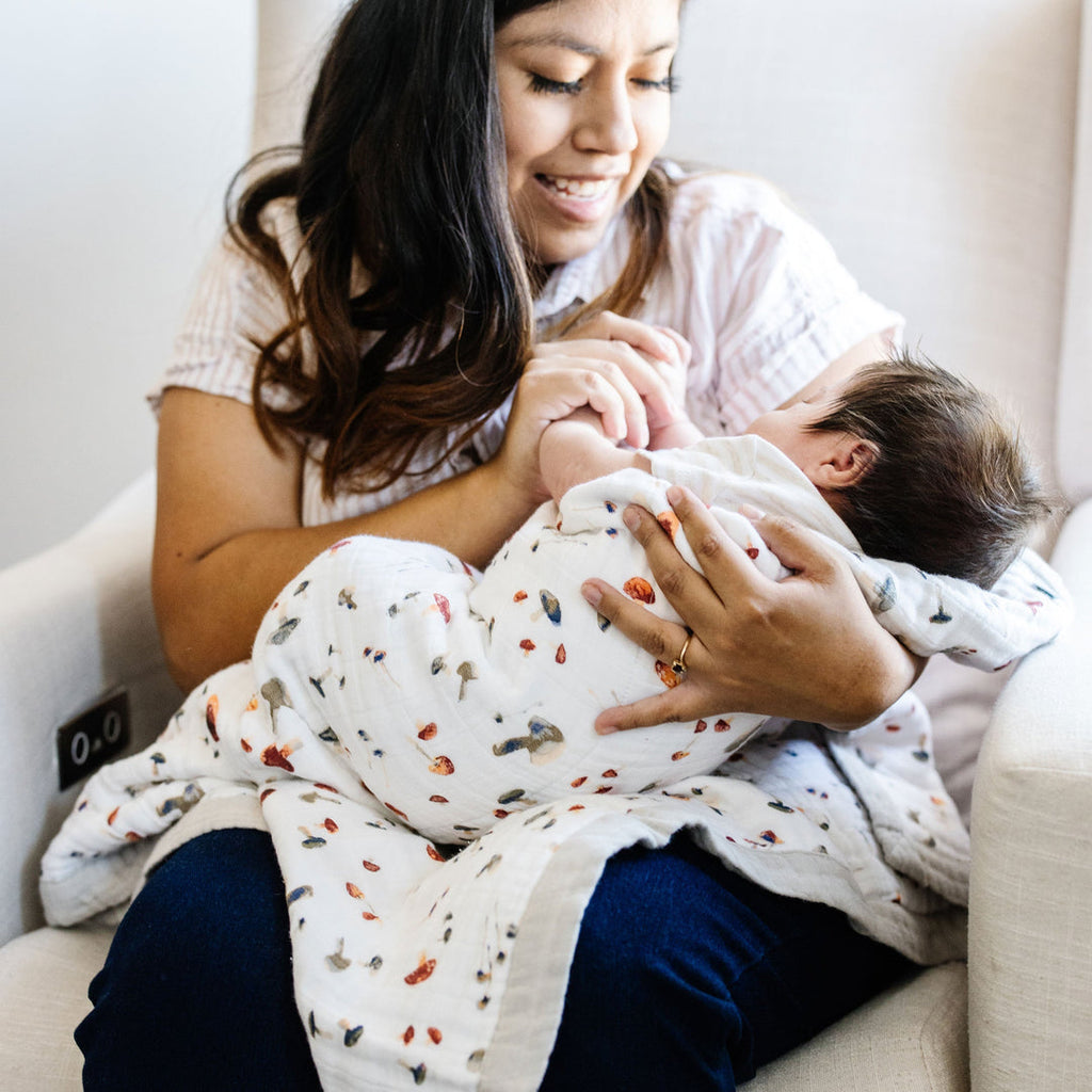 Say hello to this cute baby quilt, certain to be a favorite in your little one's blanket collection. Made from three layers of 100% cotton muslin, it's just as durable as it is soft, cozy and breathable. Perfectly sized for snuggles, tummy time or on-the-go in your favorite stroller or jogger. Printed on both sides with our signature artwork for a beautiful touch to any nursery, and as a perfect shower gift. Cotton Muslin Baby Quilt - Mushrooms.      Materials  100% cotton muslin.