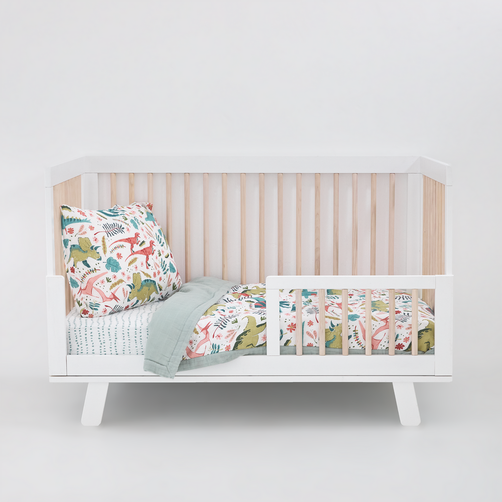 Celebrate their imagination. The Toddler Bedding Set features a variety of themes and prints to help bring their creativity to life as they transition from infant to toddler. 3 piece set includes: 1 Toddler Comforter, 1 crib sheet, 1 pillowcase. Cotton Muslin Toddler Bedding 3 Piece Set - Boho Dino 
