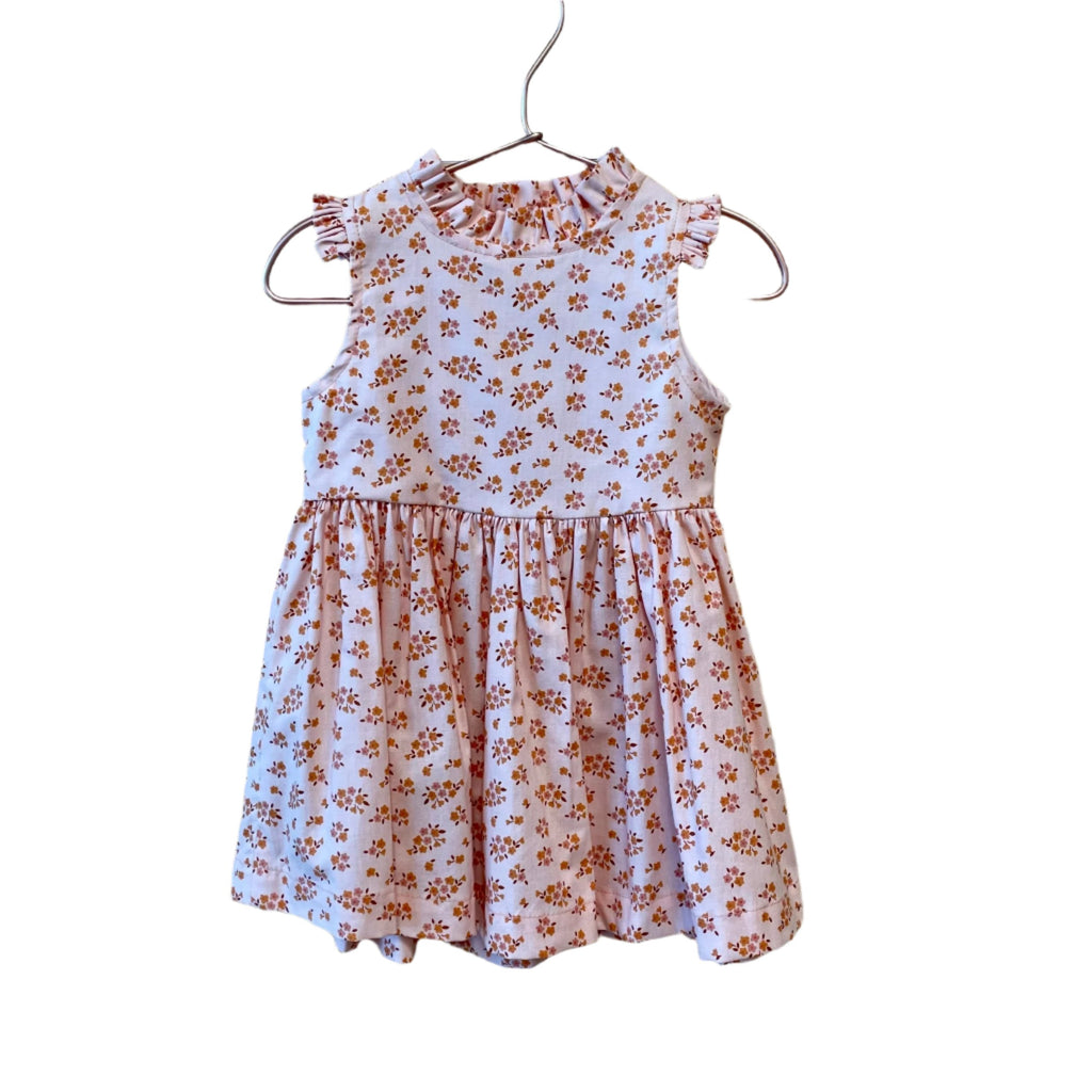 Make your garden party dreams come true in the Lily Floral Blush Dress!&nbsp;Fabric designed by&nbsp;Ashley Collett for Riley Blake fabrics.&nbsp;This gorgeous dress is sure to have heads turning - or nodding off in admiration (it's just that beautiful!). So show off your summer-ready style with this one-of-a-kind stunner!