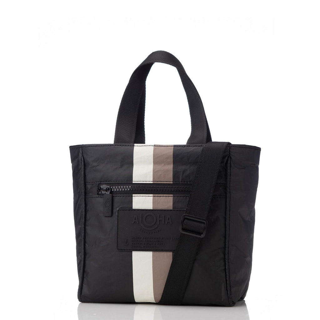 With chic styling and a sleek design, this is the black with caffe stripe crossbody you won't want to leave home without! From running errands to exploring new cities, travel with ease while staying hands-free! 