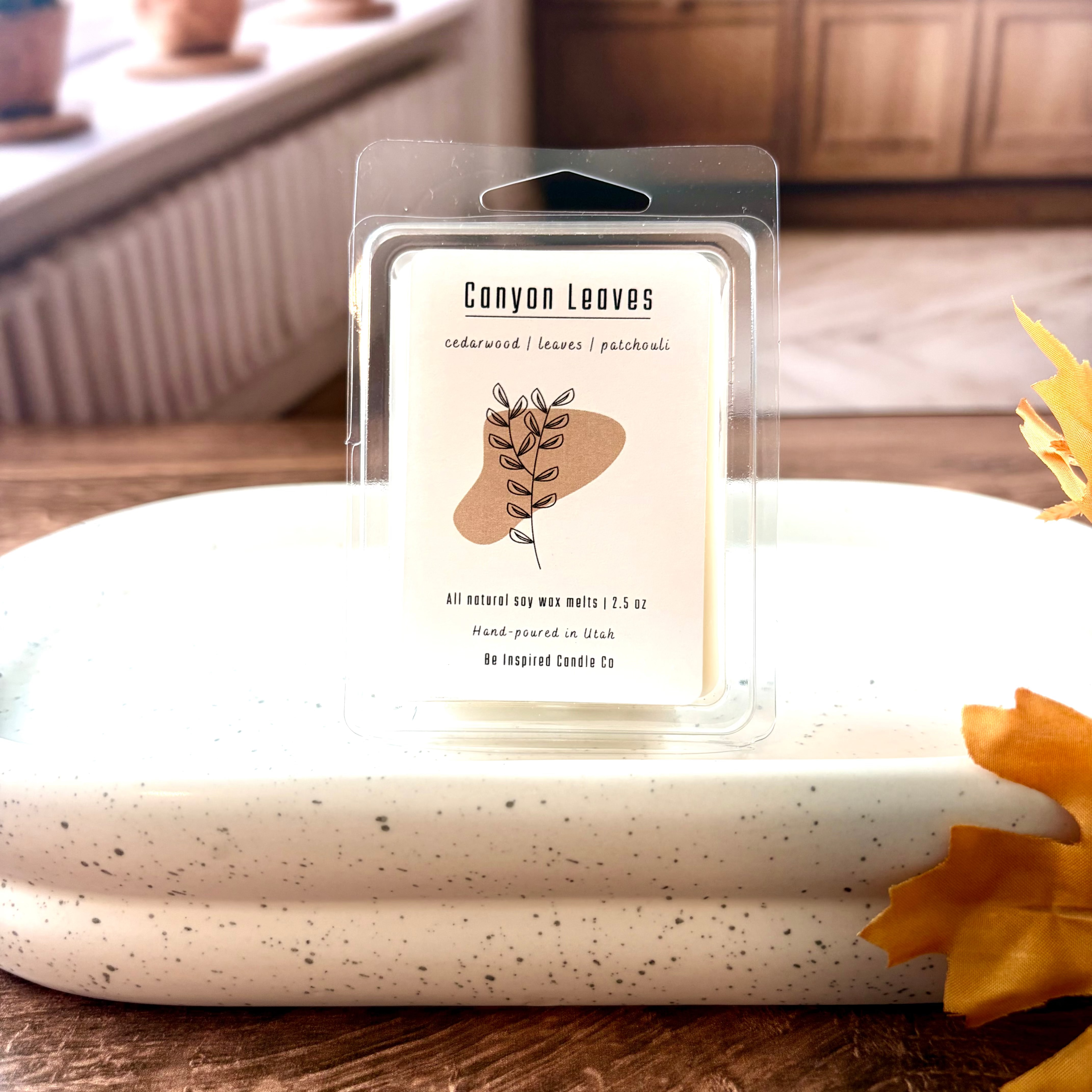 White wax melts in a clear carton with a white label. 