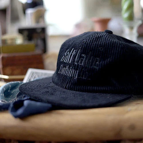 Black corduroy cap with salt lake clothing co logo