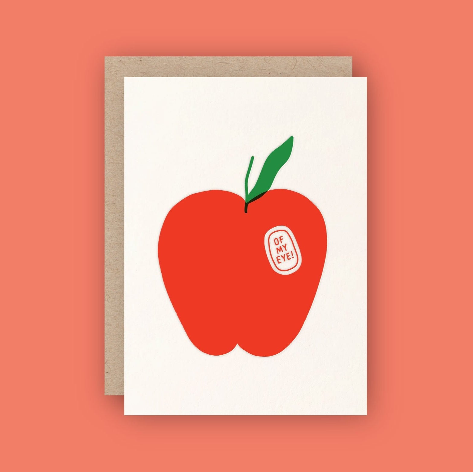 white card with a red apple and a fruit sticker reading "of my eye!"
