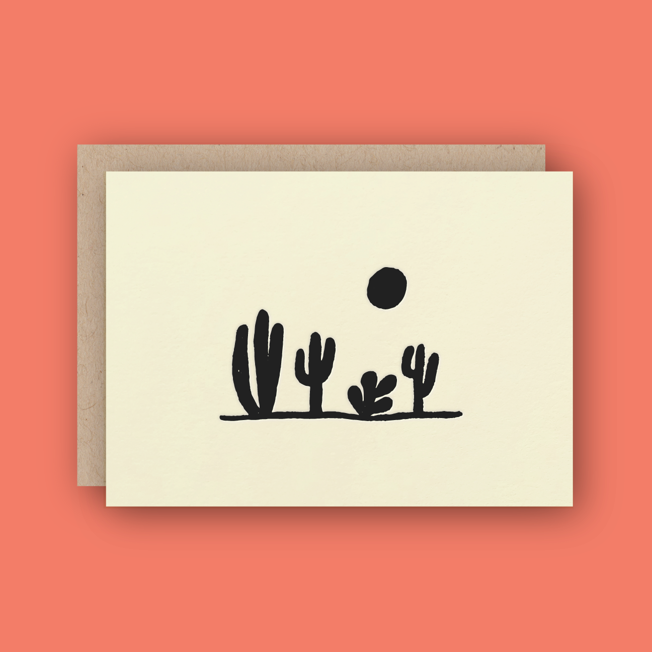 cream colored card with a black desert scene featuring four cacti and the sun