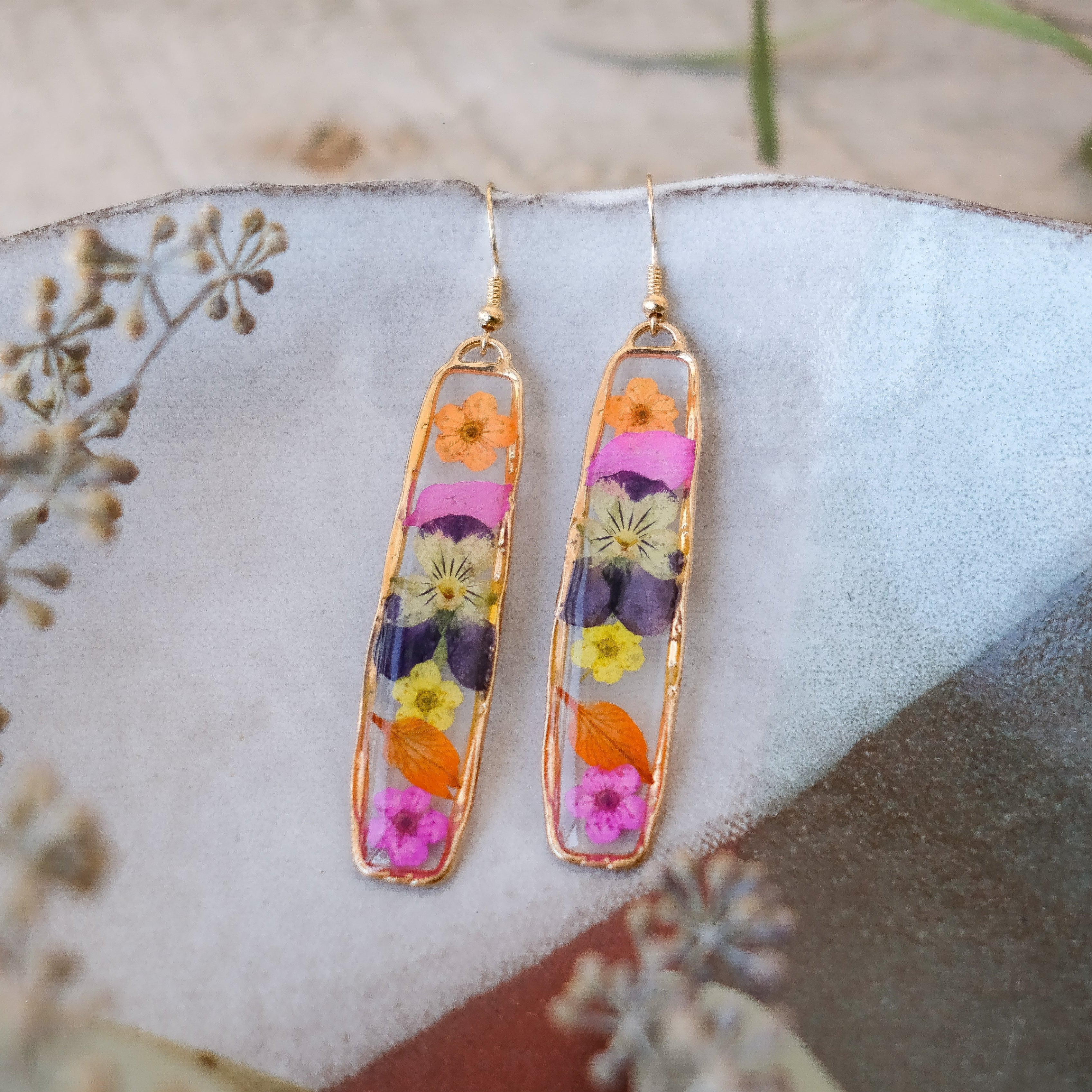 gold rectangle earrings with hand pressed pansies and flowers