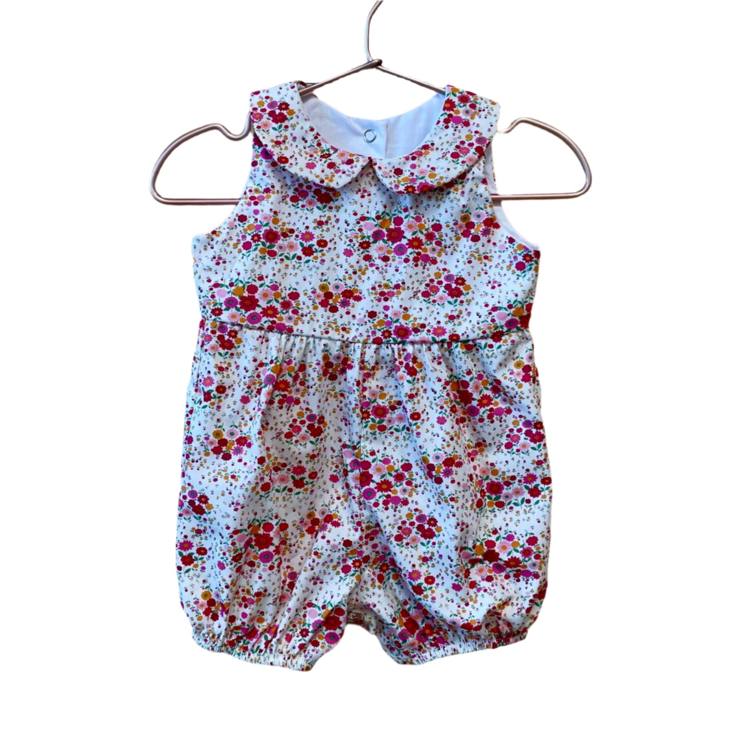 Dress up your little one in the Harper Romper and have everyone petal-ing all over your stylish babe! This beauty features Petite Garden. Pink and is sure to make your kiddo look hip and cool! Put your mini in the Harper and everyone will be buzzing like a bee!