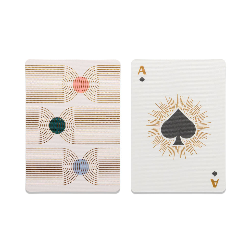 Practice your poker face or go fish in style with DesignWorks Ink Playing Cards - Arches! Whether you win or lose, our playing cards with sleek designs make even a bad hand look good! This is a standard poker size 52 card deck with a gold foil stamped tuck box and gold foil stamped cards that are custom designed and unique to DesignWorks Ink! This card design features geometric arches in a cool, desert-toned color pallet. Makes a great gift for the host, housewarming party, and game nights.