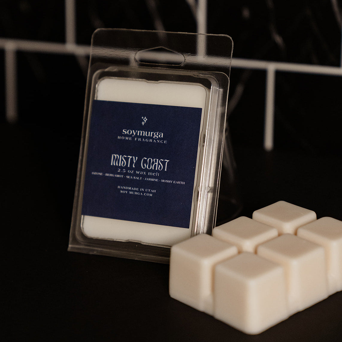 Clear packaging with a navy blue label. Pictured against a black marble back splash.