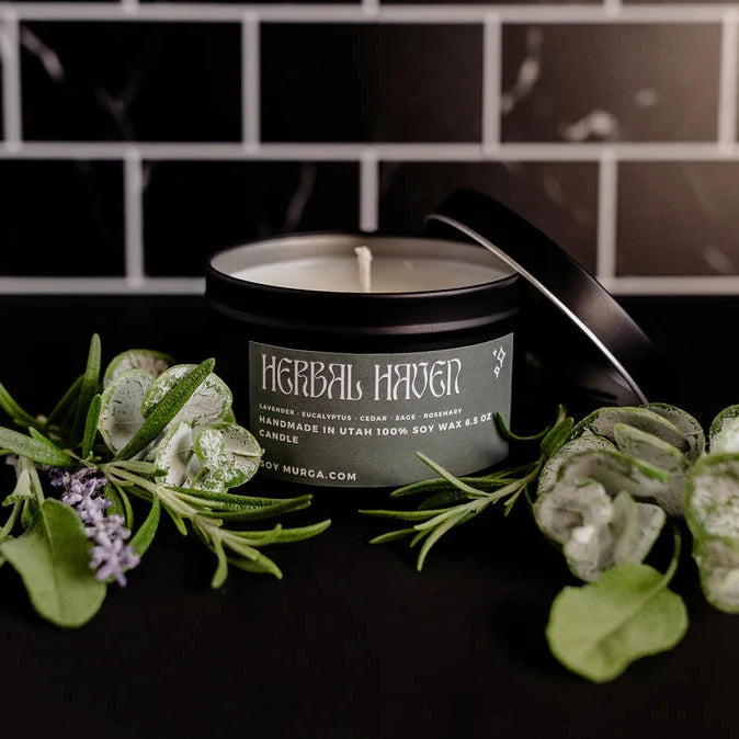 6.5 oz herbal haven soy candle hand poured in a matte black tin 