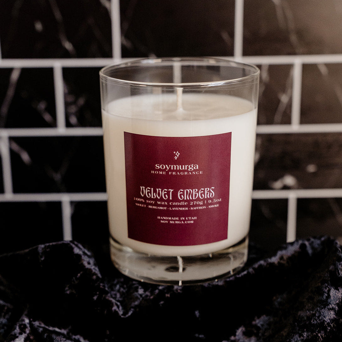 Velvet Embers 9.5 oz candle in a clear glass container. 