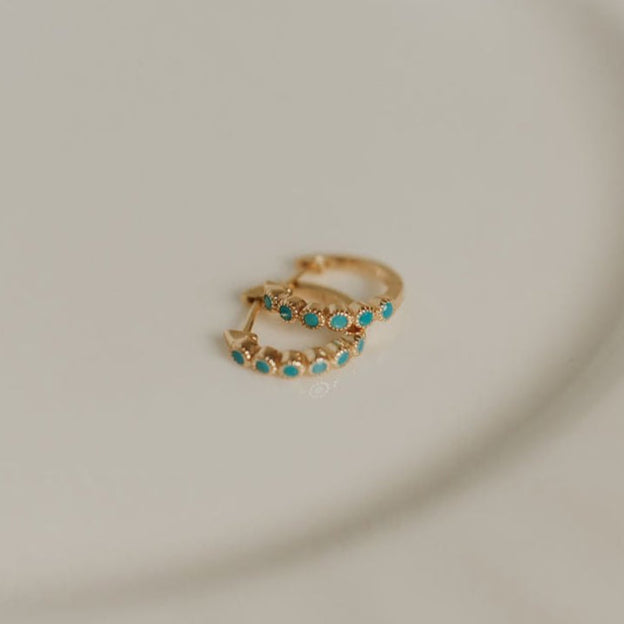 gold hoops with 6 turquoise dots along the front