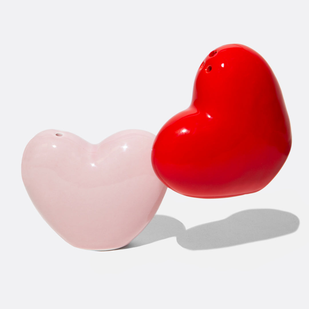 Ceramic salt and pepper shakers shaped as hearts to share and display your love at home.