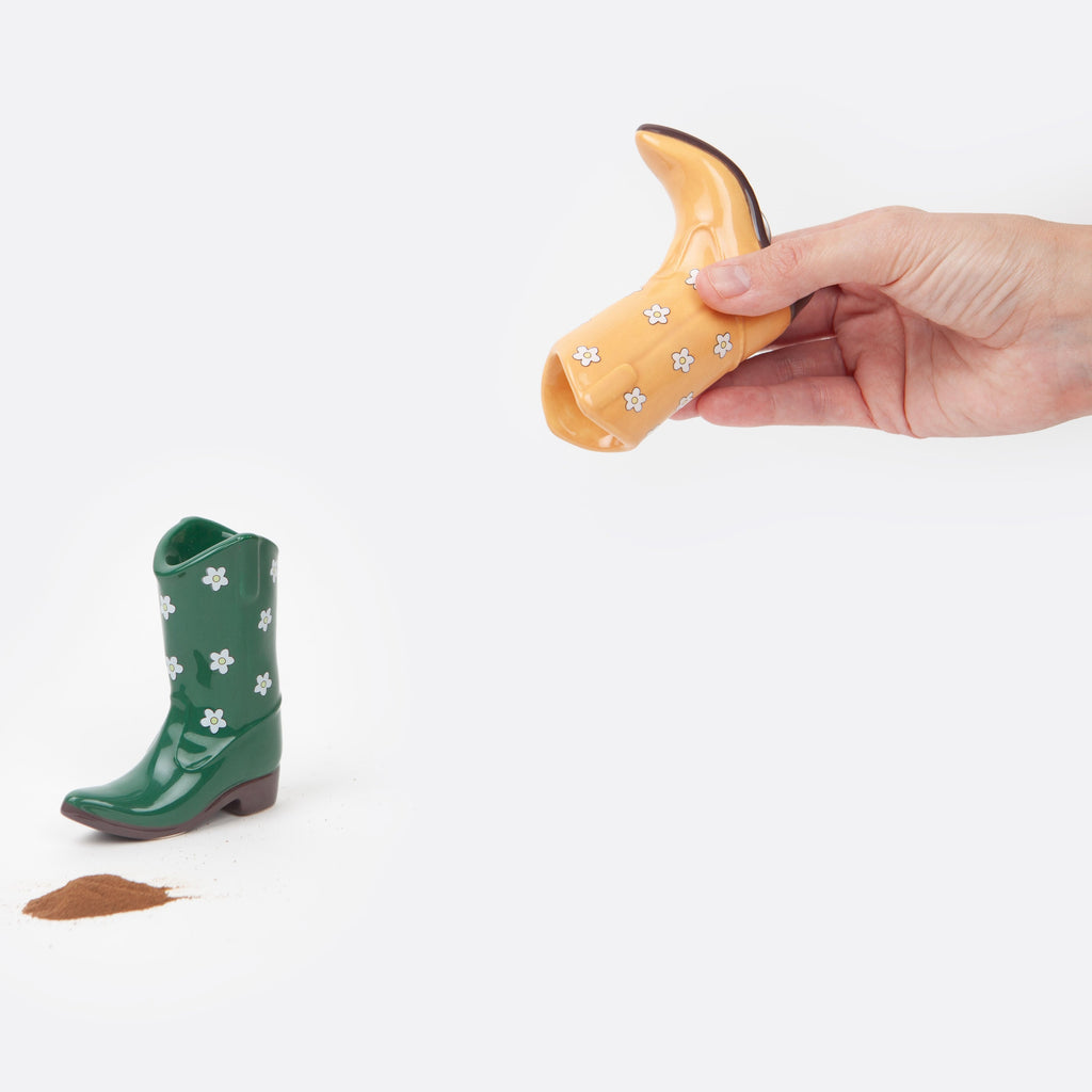 Add some southwestern charm to your table with these playful Yellow &amp; Green Cowboy Boot Salt &amp; Pepper Shakers. These quirky shakers will bring a touch of whimsy to any meal, making seasoning your food an enjoyable experience. Spice up your kitchen with these fun and functional shakers!
