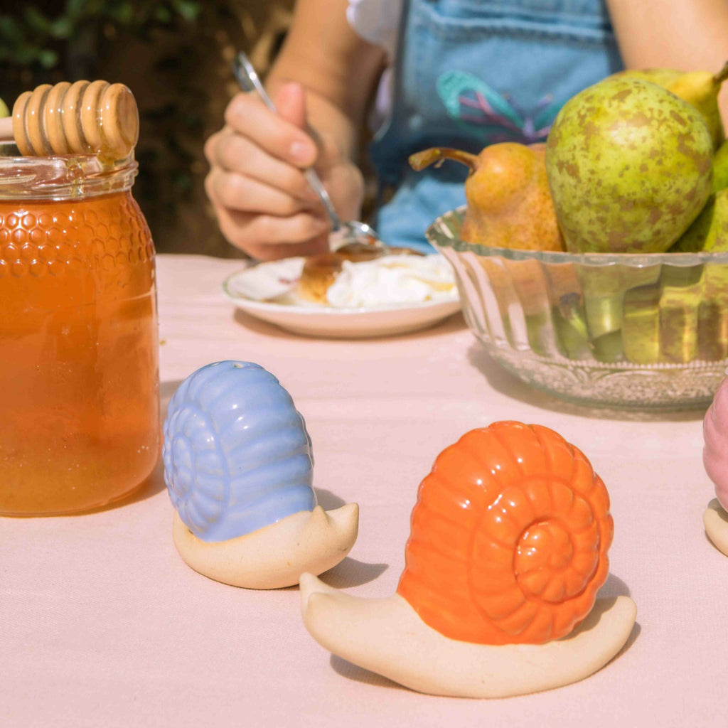 Add a pop of color to your dining experience with these playful Lilac &amp; Orange Salt &amp; Pepper Shakers. These quirky shakers will spice up your meals and add a touch of fun to your table. Indulge in flavorful meals with this unique set.