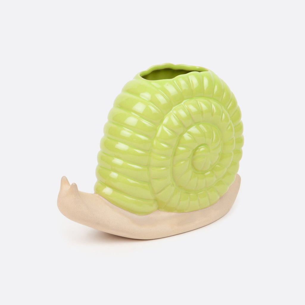Add a touch of whimsy to your home decor with our Green Snail Vase. Its unique design is sure to make a statement and bring a smile to your face. Perfect for displaying your favorite flowers or as a standalone piece, this vase will surely delight you and your guests.