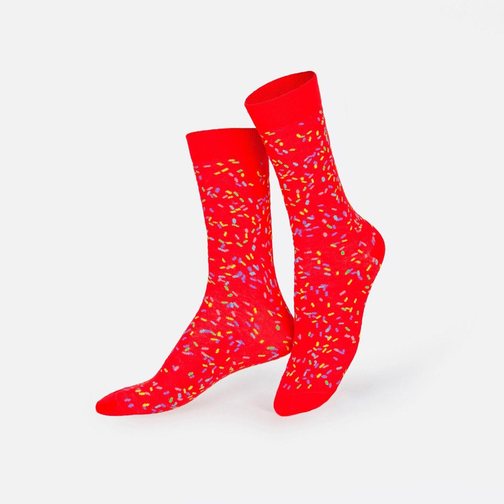 Red socks with colorful confetti throughout.