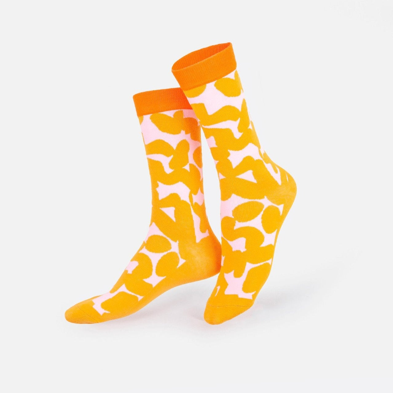 A cozy pair of socks snugly packed within a familiar peanut butter jar makes for an unexpected and delightful gift.