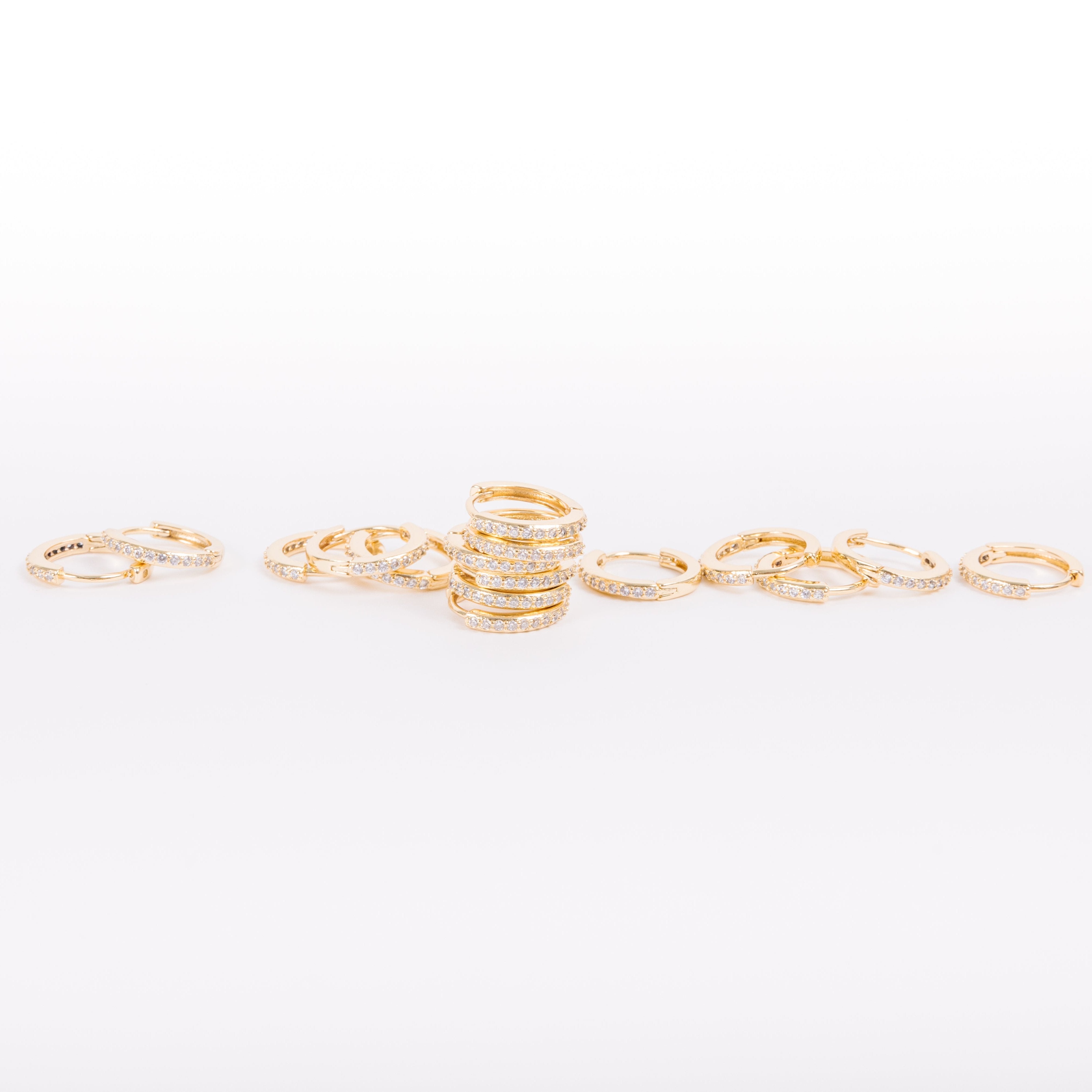 Our gold diamond huggies have been our bestselling earring for over a year, and it's no wonder.&nbsp; With a stunning and classic design, these earrings go with EV. ERY. THING.&nbsp; They are both timeless and on trend.&nbsp; Their&nbsp;unique click in click out clasp&nbsp;allows you to&nbsp;leave them in day and night without any discomfort.&nbsp;