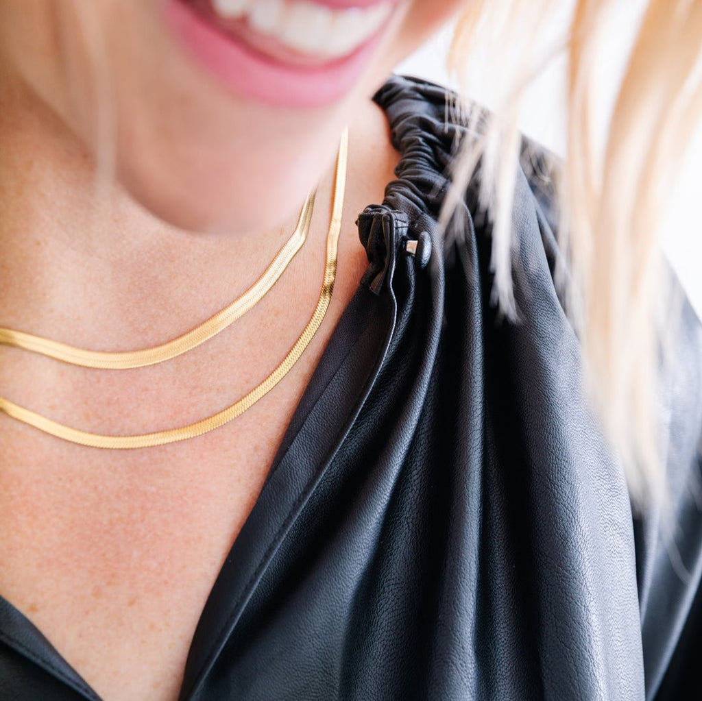 14k gold filled chain over stainless steel. Hypoallergenic, will not tarnish, will not irritate skin. Available in 3 mm (Skinny Brene) or 4 mm (Brene). Available in 15.5-17.5" length (Has a two inch extender on the back) or 17.5-19.5"