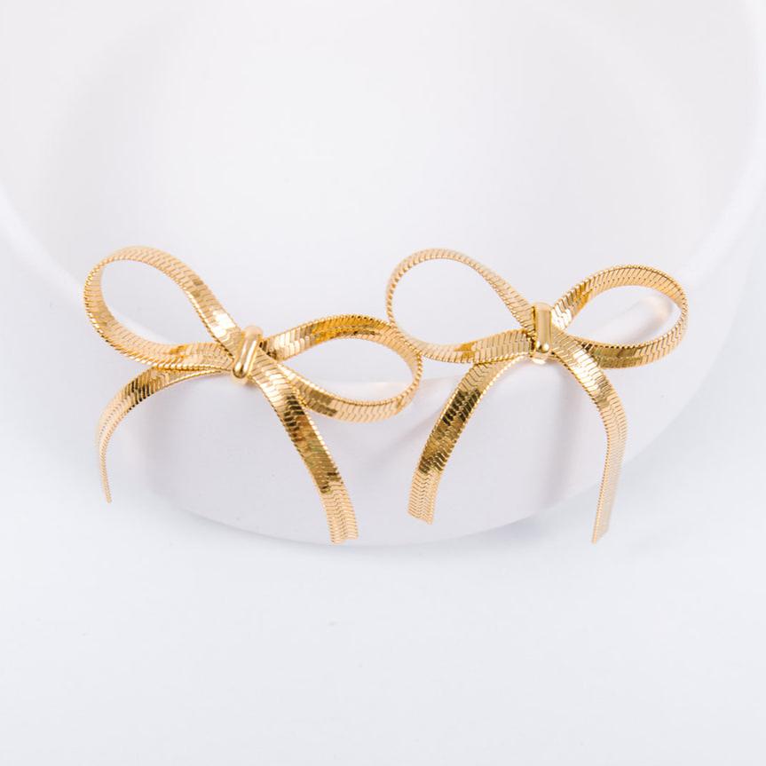 14k gold plated Statement dangling bow measures 3.5cm wide and 4.2 cm tall Check out our jewelry care guide for how to make sure you get max wear on your gold filled jewelry. Hypoallergenic