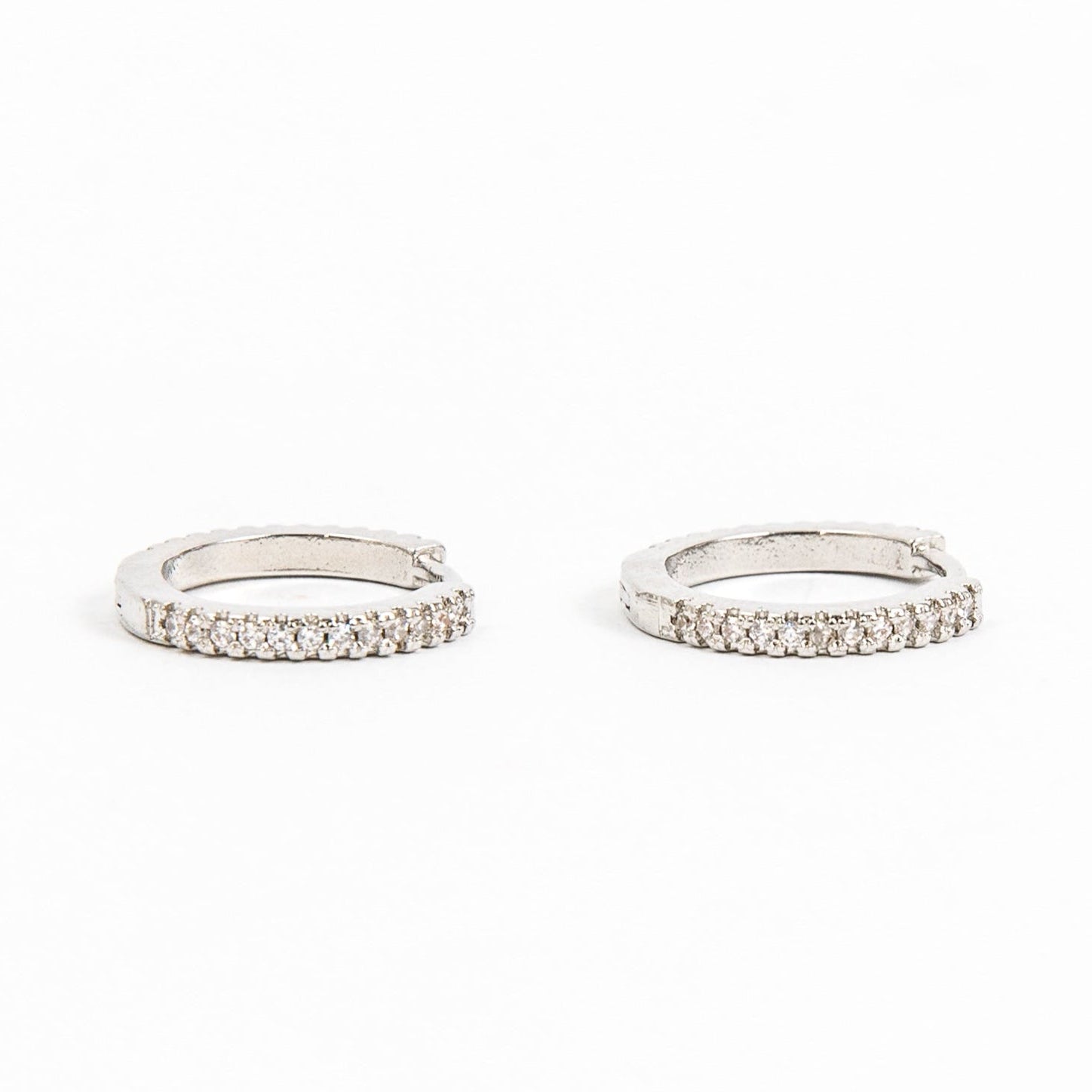 silver huggie with inset diamonds. 