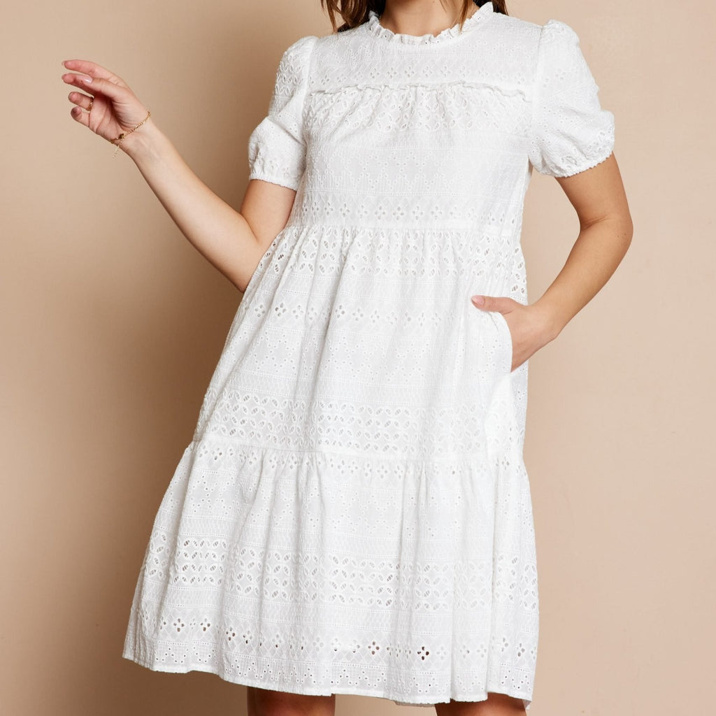 Get ready to turn heads in this Eyelet Tiered Dress! Featuring a playful tiered design and crisp white eyelet fabric, this dress is perfect for any occasion. Don't miss out on the opportunity to make a statement with this unique piece.&nbsp; <span style="color: var(--dark-text-color); font-family: -apple-system, BlinkMacSystemFont, 'San Francisco', 'Segoe UI', Roboto, 'Helvetica Neue', sans-serif; font-size: 0.875rem;">Eyelet Tiered Dress</span>