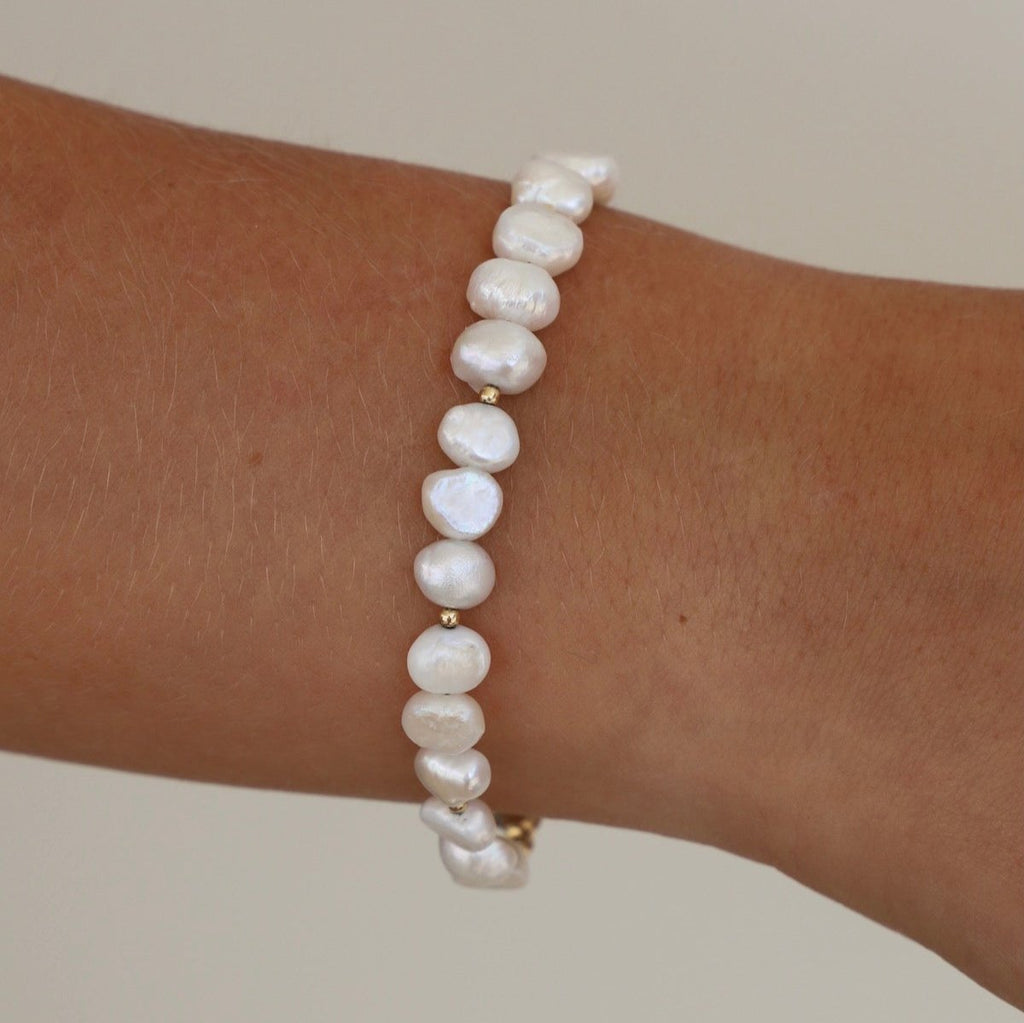Our Kailani Bracelet is a beautiful beachy bracelet that is perfect to style everyday for this summer season. Made out of our freshwater nugget pearls and gold beaded accents, everyone will be asking you where you got your modern pearl bracelet.