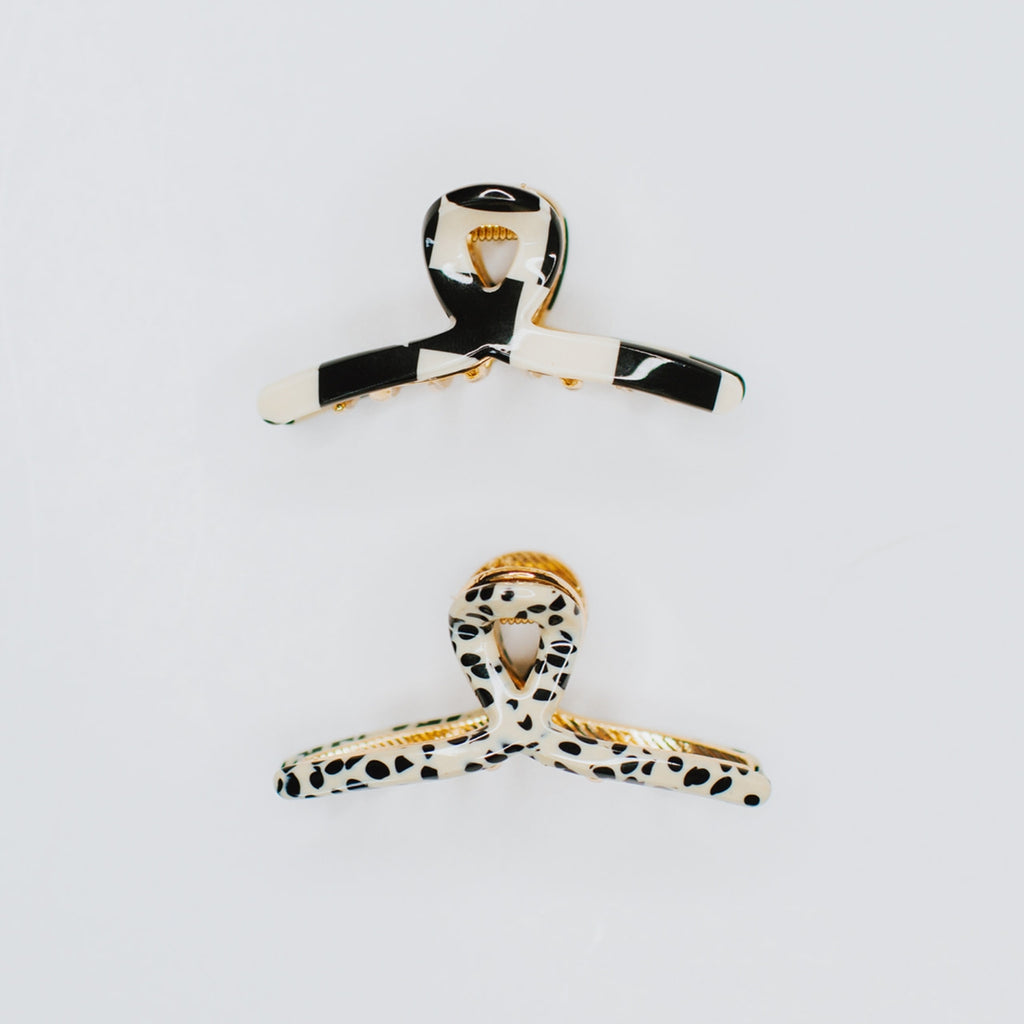 This pack includes two trendy pieces, a black checker and a spotted cream &amp; black hair claw, both made from high-quality acetate. These hair accessories are designed to add a touch of retro flair to your look while holding your hair tightly in place. Whether you're going for a casual or formal look, these Tiny Gold Loops will be your new best friend!
