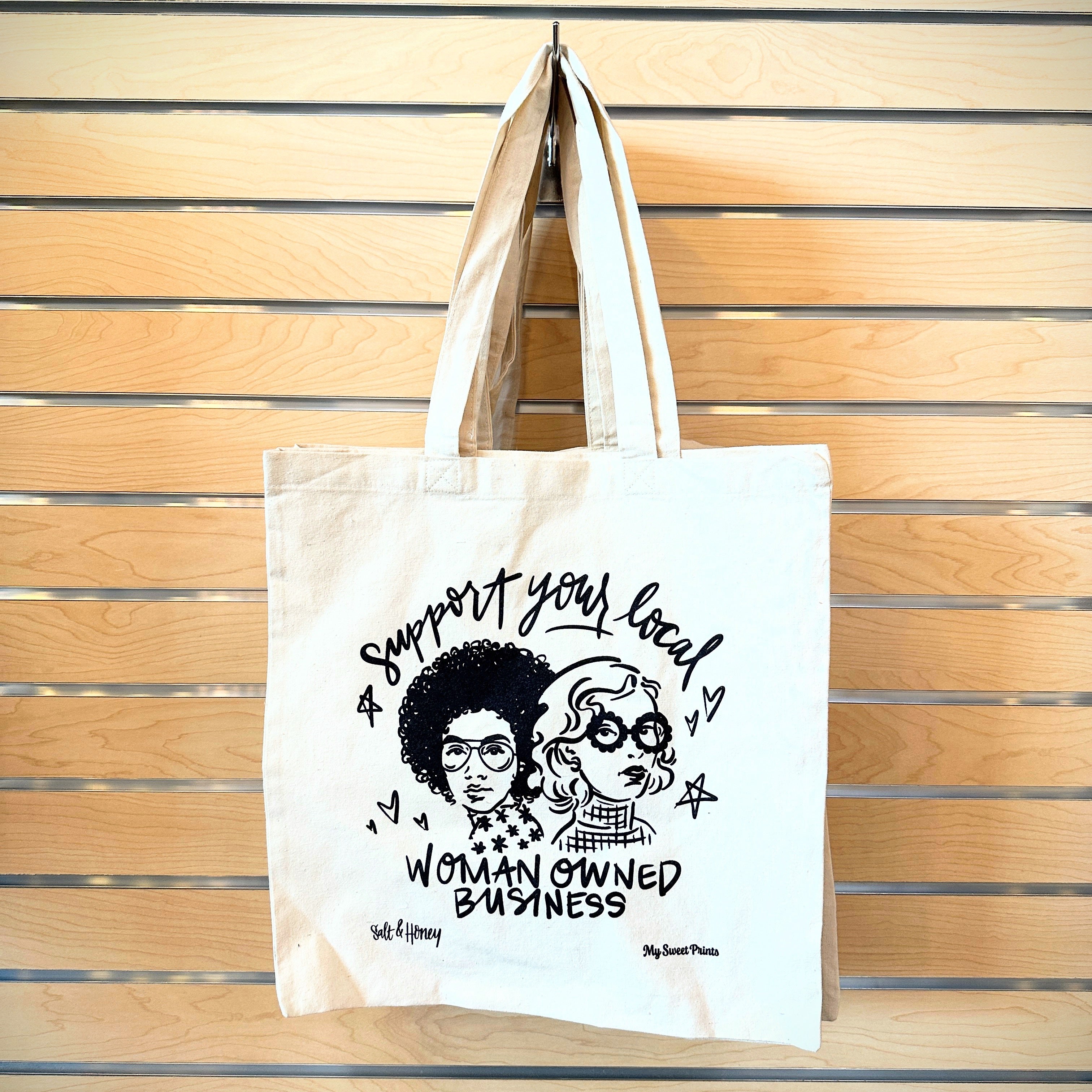 Elevate your style with our Iconic Business Women Tote. Featuring stunning artwork of influential women, this tote is locally designed and made in partnership with My Sweet Prints. The spacious canvas tote is perfect for carrying all your essentials while making a statement.