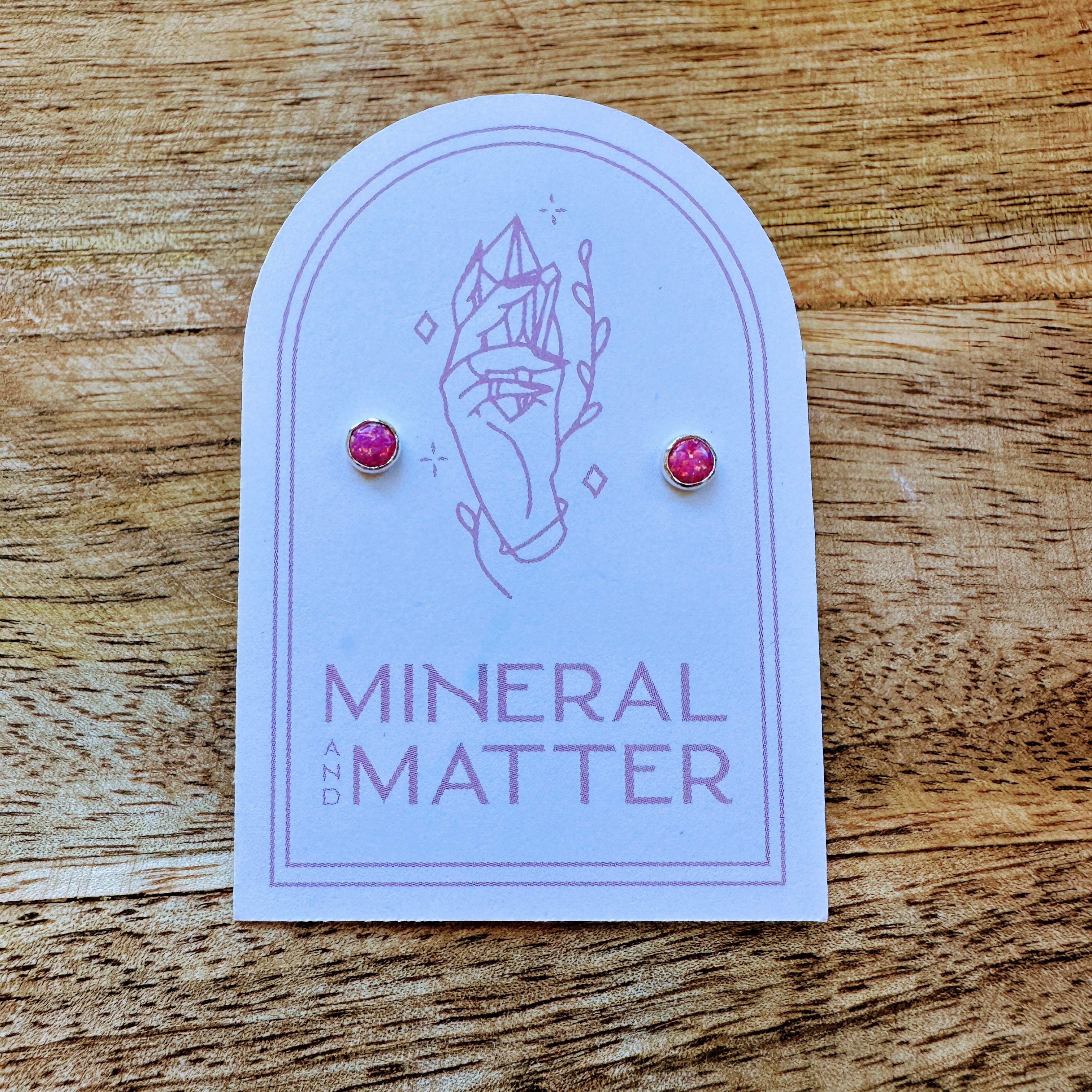 These Small Cherry Pink Opal Studs are the perfect accessory for any outfit. The vibrant cherry pink opal adds a pop of color, while the small size makes them comfortable to wear all day. Elevate your style and brighten up your look with these beautiful earrings.