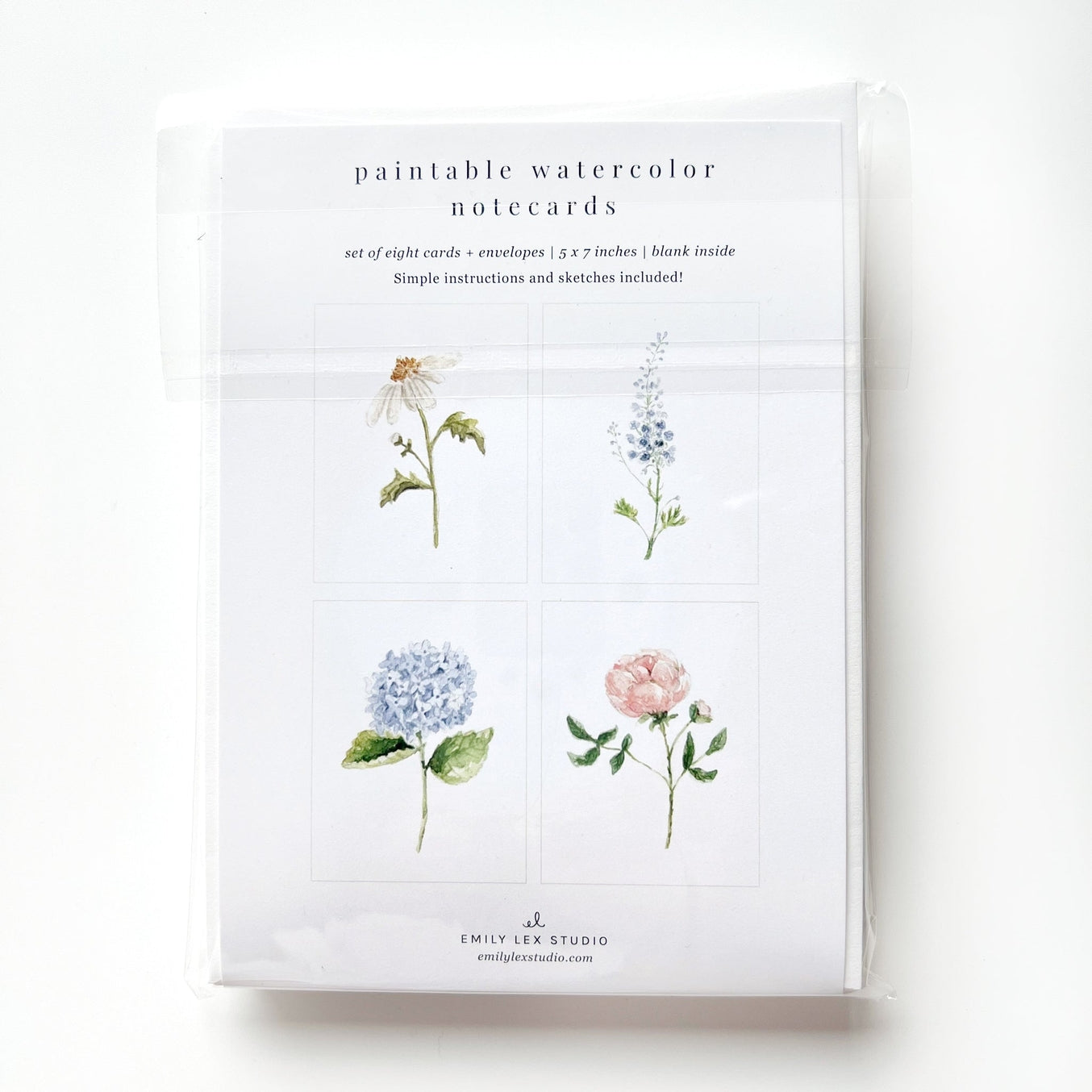 Paint your own special cards to send to loved ones! Sketches are printed on the front of each card with simple instructions for you to paint in with watercolors. You'll receive eight cards with two of each illustration: hydrangea, garden rose, delphinium and daisy. Perfect for artists of all ages!
