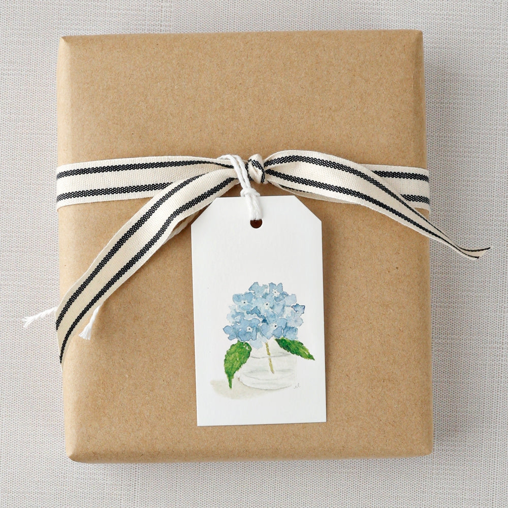Add a finishing touch to your wrapped gifts with a cheerful gift tag. Blank on reverse for space for a note or name.