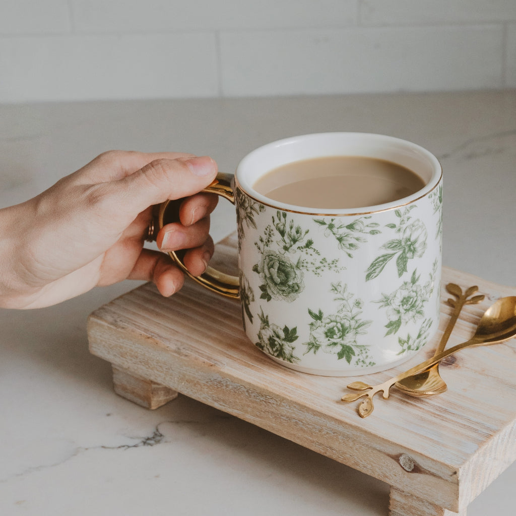 Our Green Delft stoneware mug features a timeless floral design and calming green hue. Perfect for savoring your favorite brew with a touch of elegance and style.