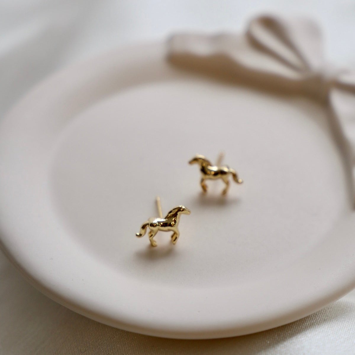 Add a playful touch to your outfit with our Mini Horse Studs! These quirky studs add a fun twist to any look. Perfect for animal lovers or those who crave a bit of whimsy in their accessories.