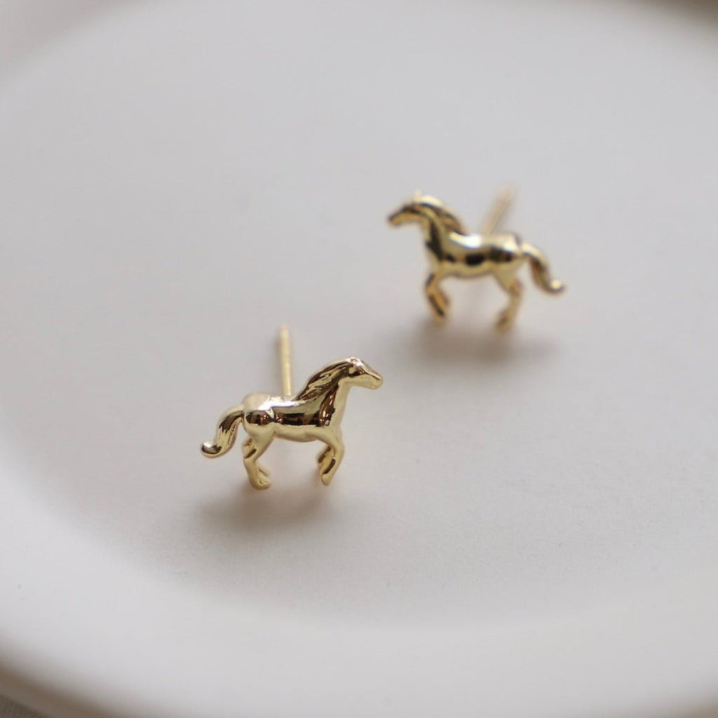 Add a playful touch to your outfit with our Mini Horse Studs! These quirky studs add a fun twist to any look. Perfect for animal lovers or those who crave a bit of whimsy in their accessories.