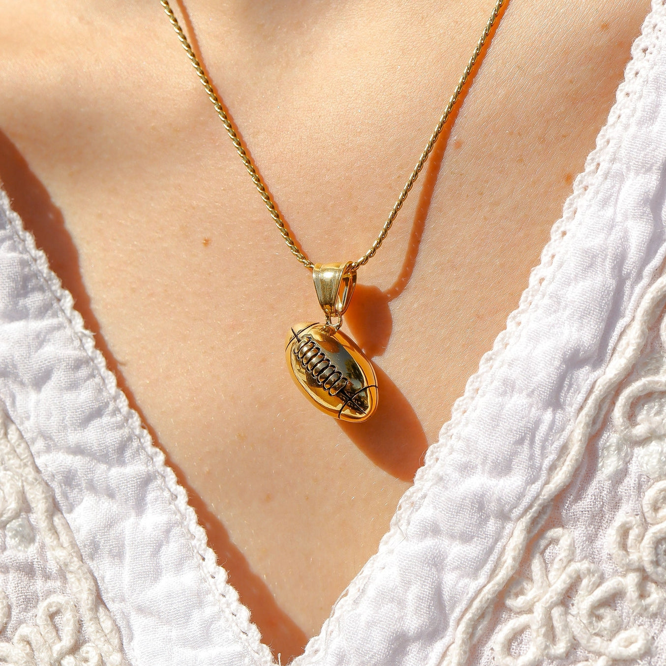 Bring a touch of sophistication to the world of sports jewelry with our 18K Gold PVD 3D Football Pendant. This expertly crafted pendant features a detailed, three-dimensional design of a classic football, symbolizing the passion and excitement of the game. Made with our proprietary blend of surgical-grade 18K Gold PVD coated stainless steel designed for everyday wear that you or a loved one can cherish for years to come!