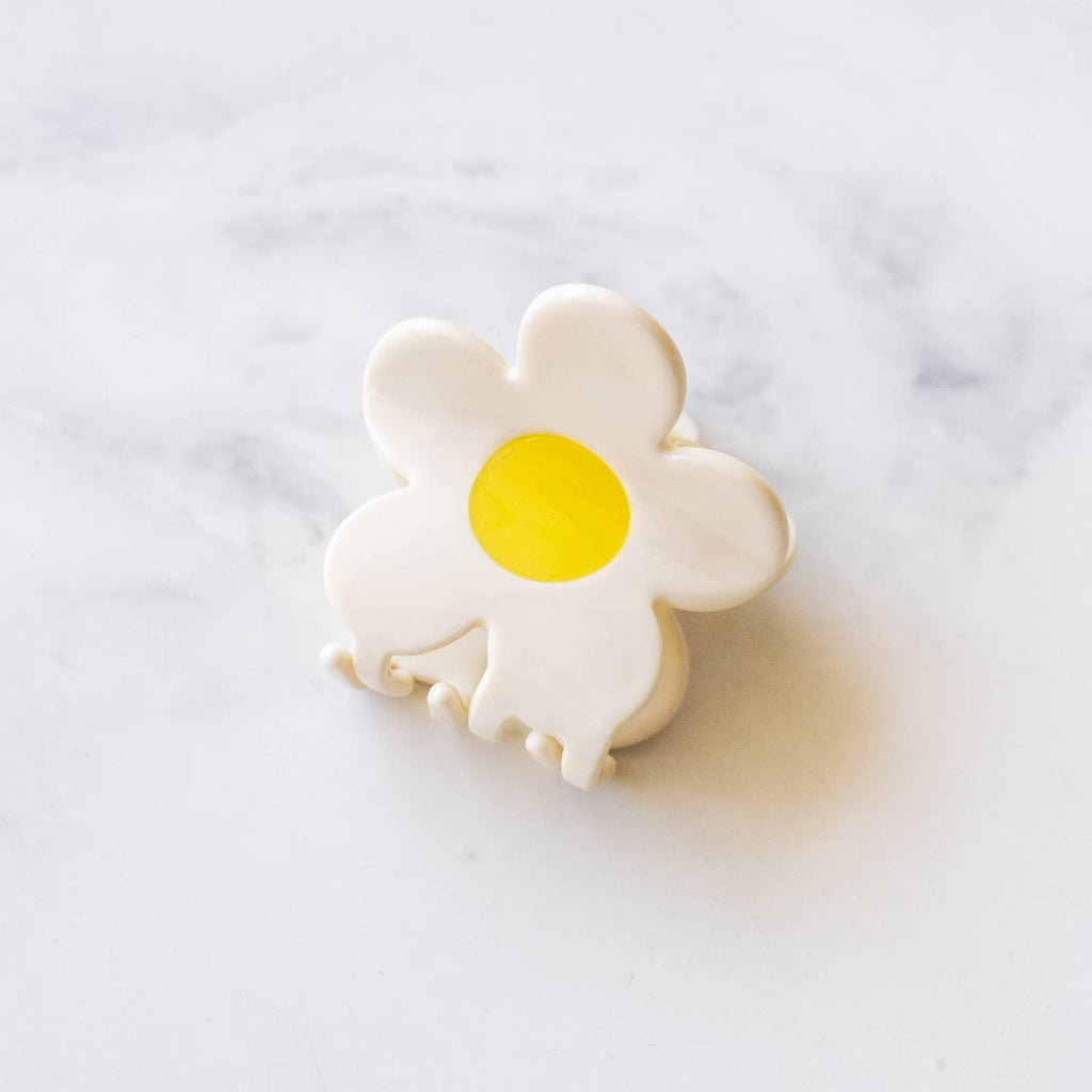 Perfect for half-tied hair. Its vintage and retro design adds a cute touch to any hairstyle. Made with eco-friendly materials, it holds hair in place securely. A must-have for an environmentally-conscious and stylish individual.