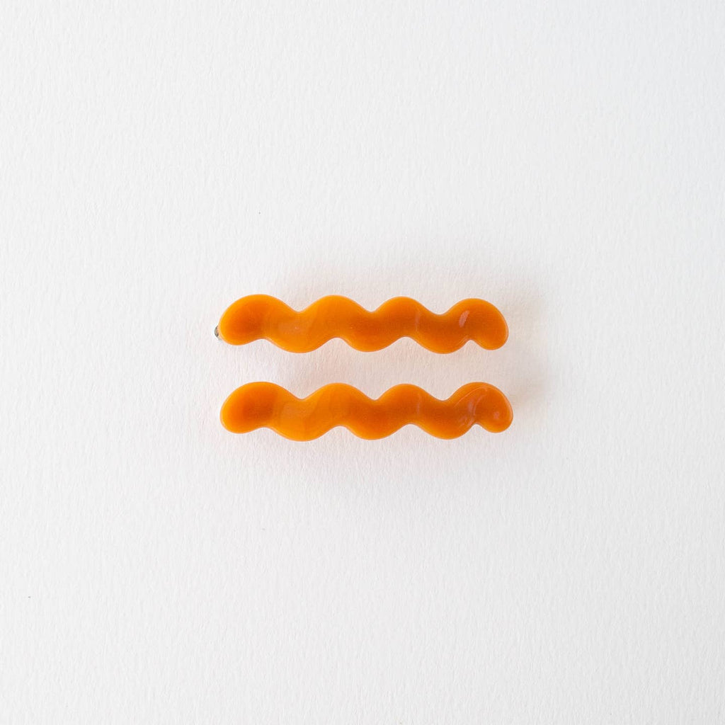 Experience effortless styling with the Eco Cloud Wave Slide Hair Pin Set. Crafted from eco-friendly materials, this set includes 2 unique cloud-wave slide hair pins that let you customize your look. With their easy slide-in design, keep your hairstyles looking as fresh as ever without damaging your locks. Set of 2.